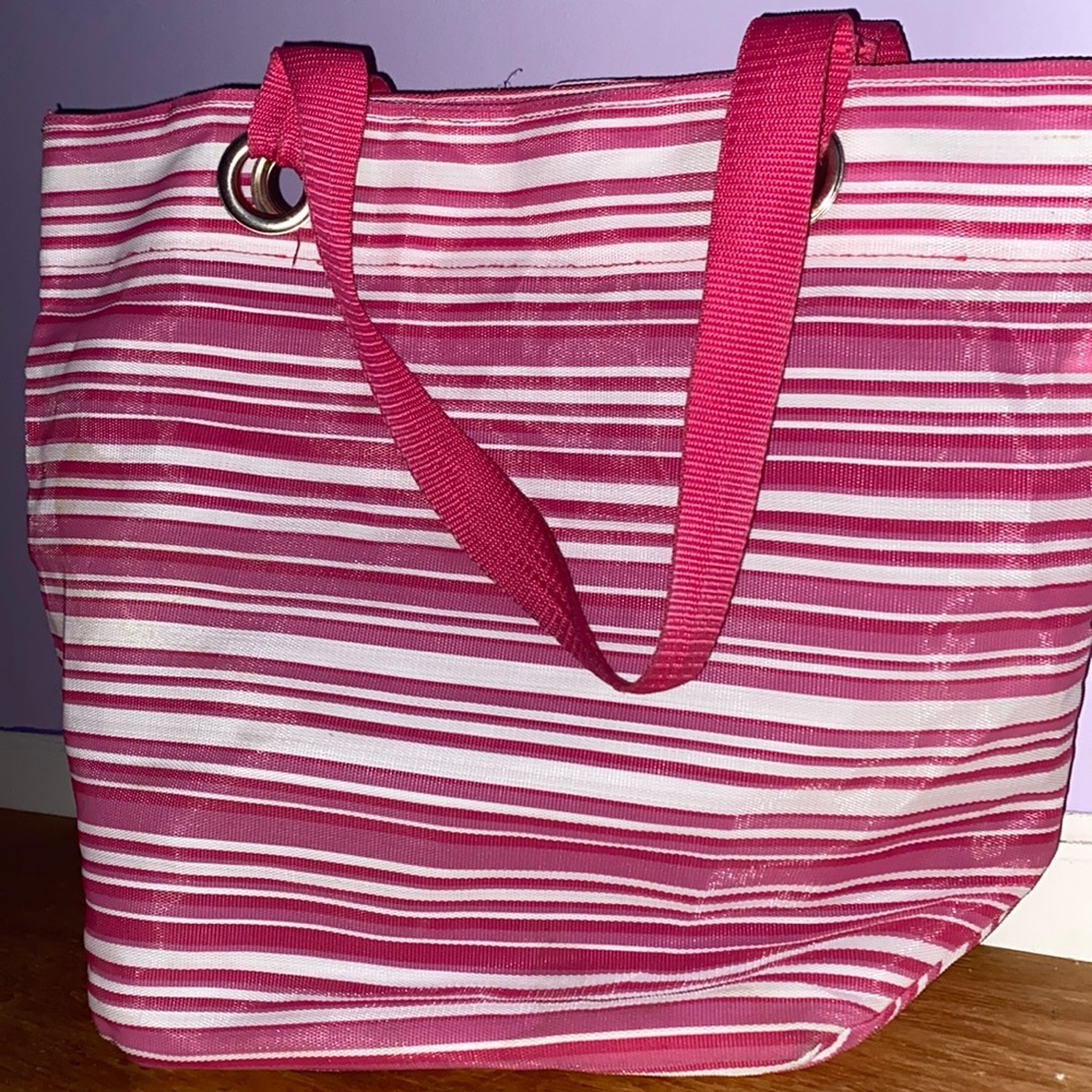 Pink and white strap bag